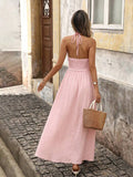 Back view of pink boho halter maxi dress with open back and halter tie