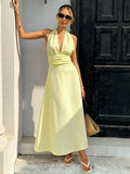 Yellow and white striped halter maxi dress