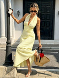 Yellow and white striped maxi dress with draped hem
