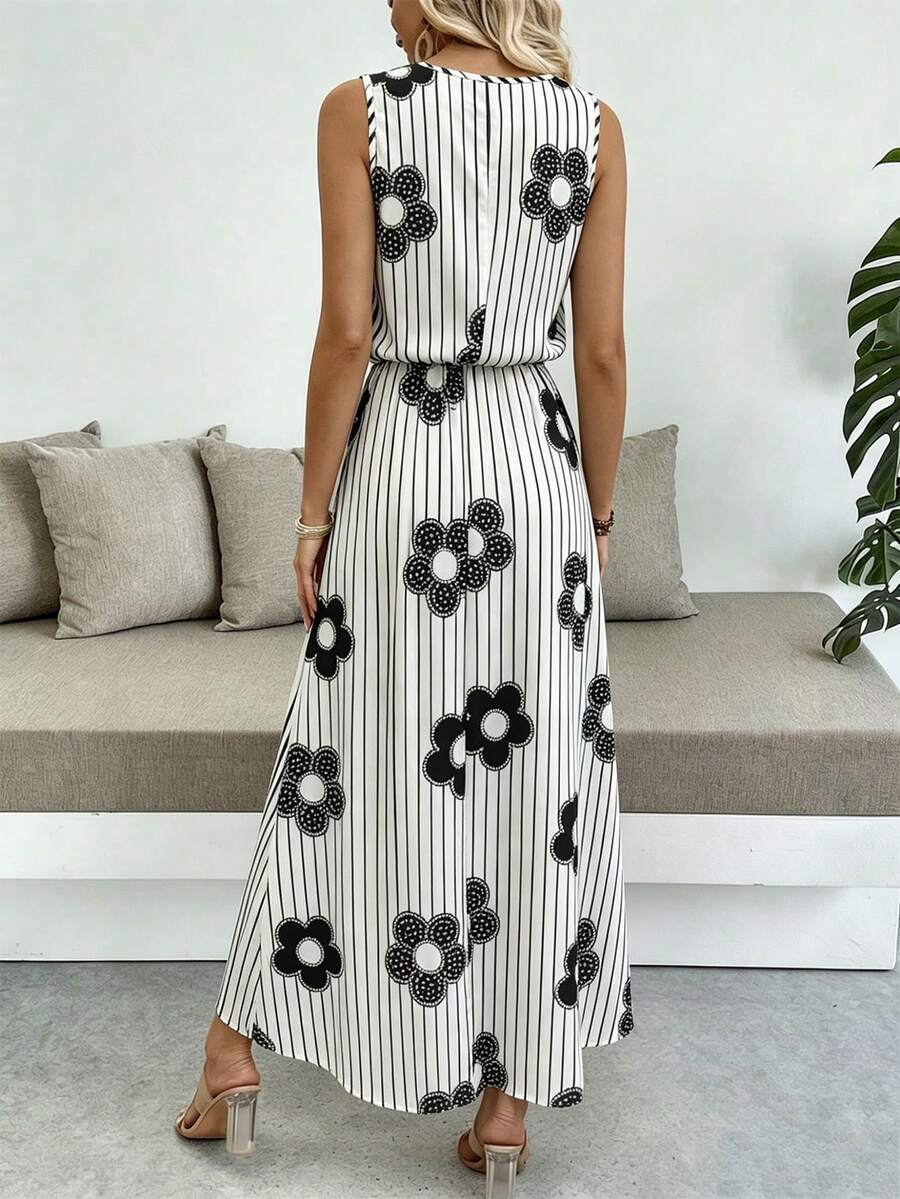 Front view of white sleeveless maxi dress with black pinstripes and floral print