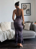 Back full body view of purple leopard print open back halter maxi dress
