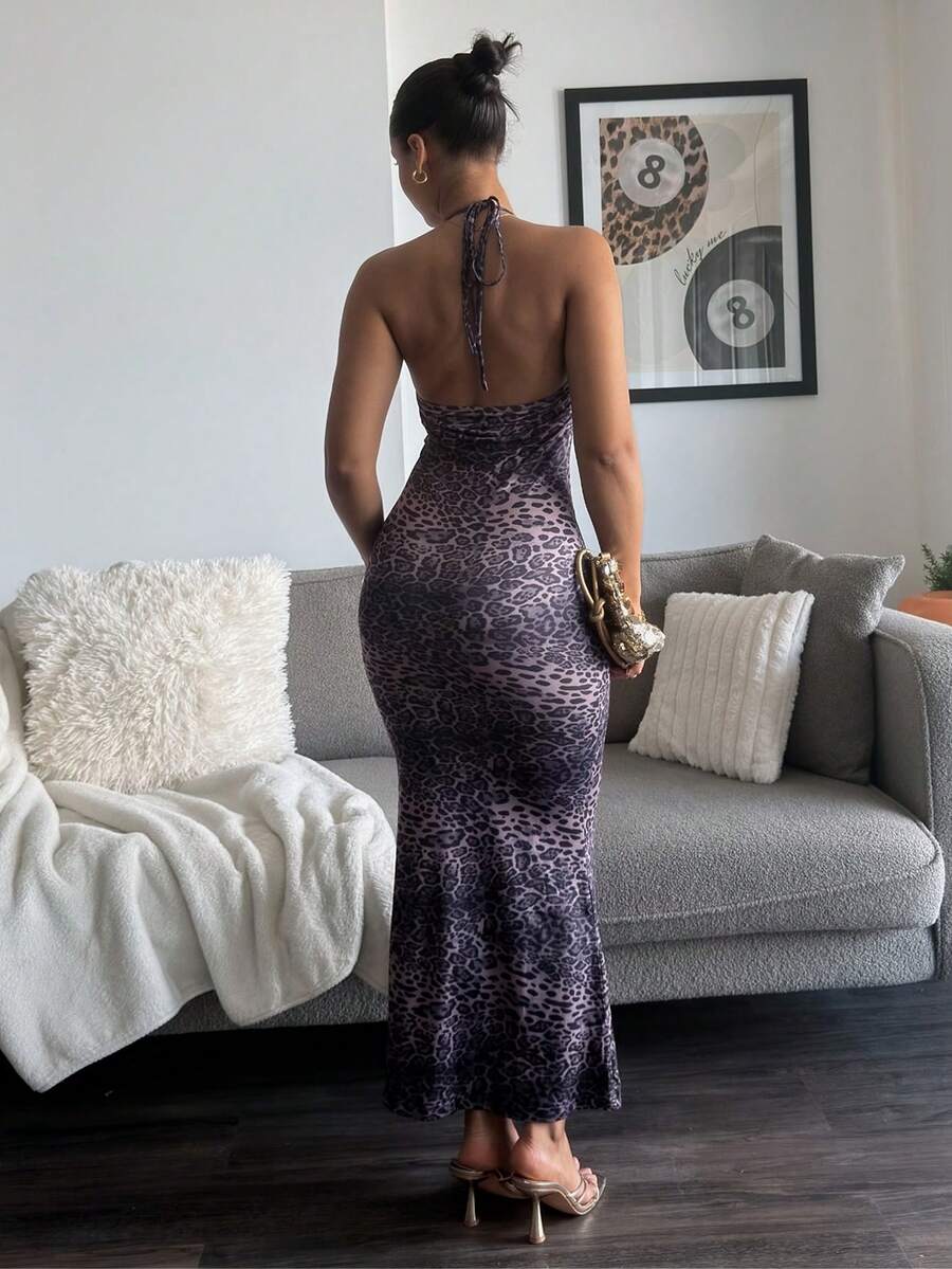 Back full body view of purple leopard print open back halter maxi dress