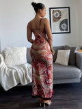 Back view of floral paisley maxi dress with spaghetti straps and burgundy ruffle hem