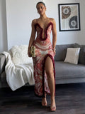 Full front view of paisley bodycon maxi dress with burgundy edging and sheer mesh look