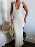 Side front view of white bodycon column maxi dress with textured hem