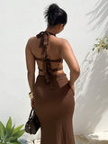 Back view of coffee halter maxi dress with open tie back and slim long skirt