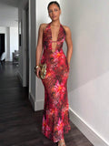 Straight front view of red printed plunging V neck maxi dress with front cutouts