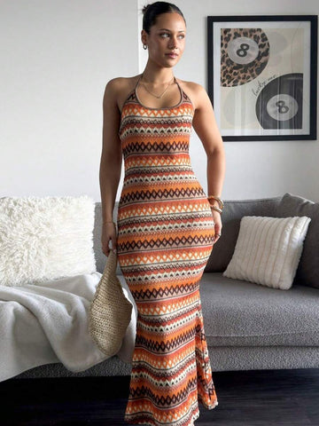 Front standing view of geometric stripe halter bodycon maxi dress