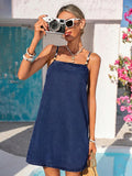 Full front view of dark indigo A-line denim mini sundress for vacation