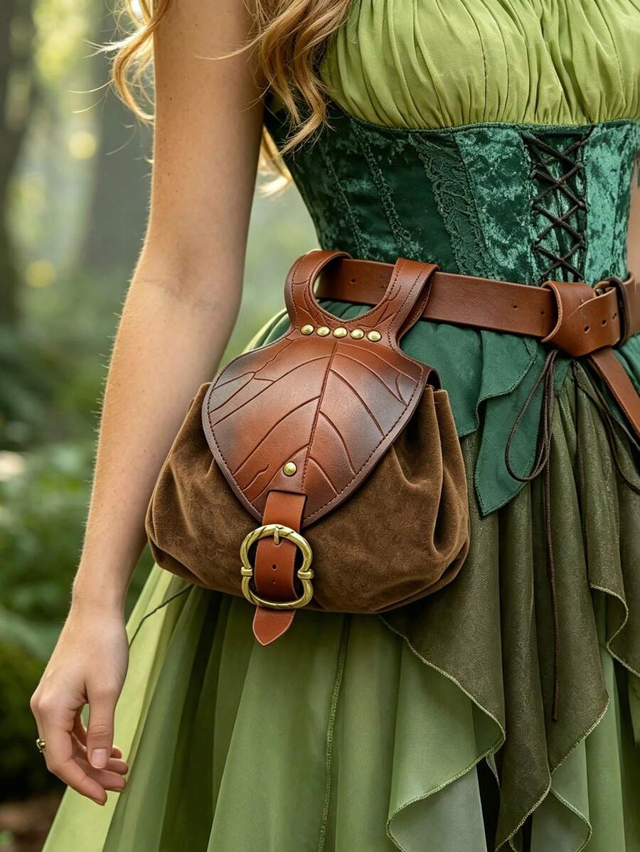 Front close-up of brown medieval belt pouch with leaf embossed flap and brass buckle