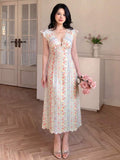 Close detail view of cream floral striped V neck lace trim midi dress showing visible color, trim, and silhouette
