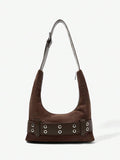 Lifestyle view of brown belt shoulder bag worn under arm