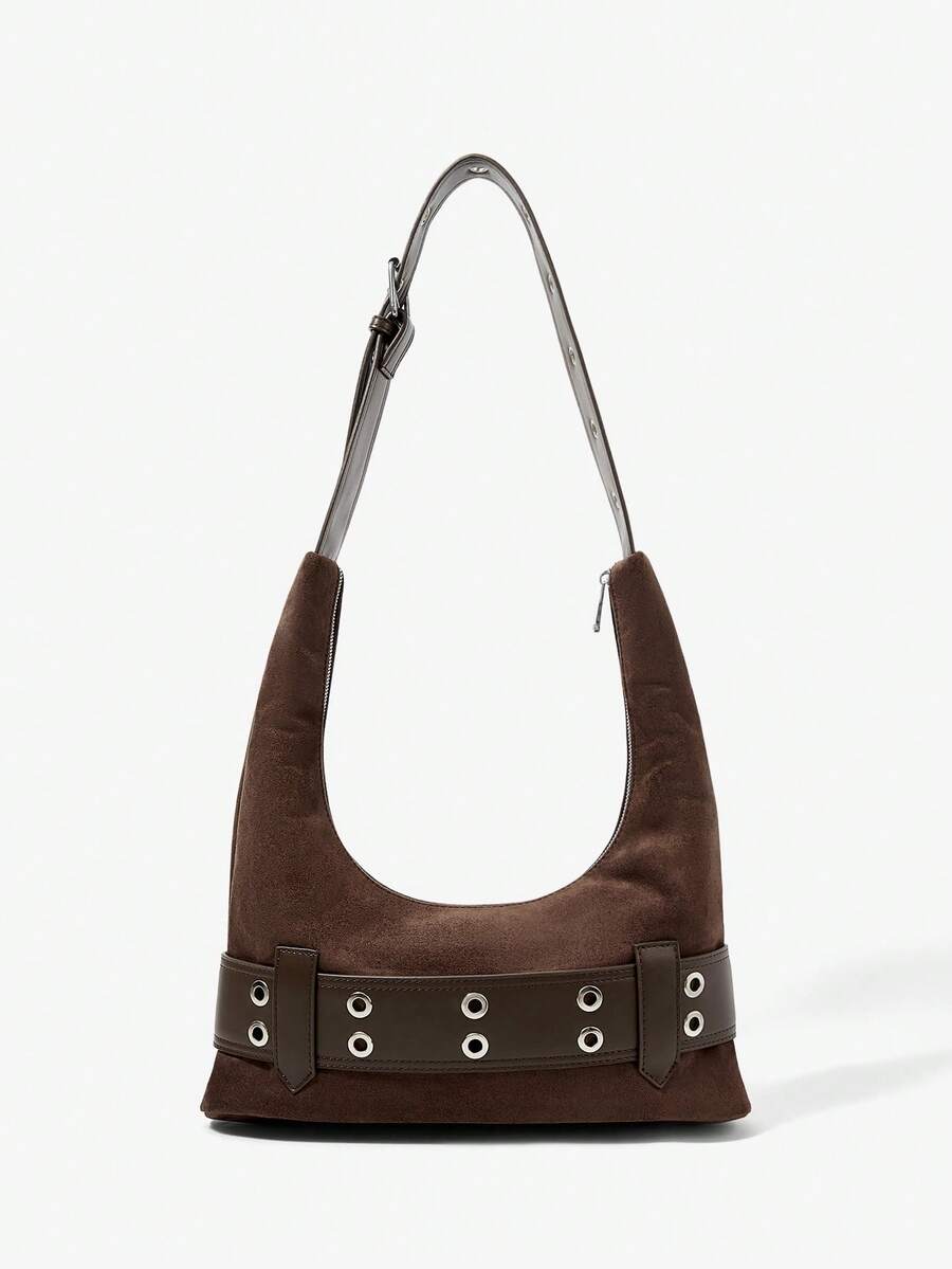 Lifestyle view of brown belt shoulder bag worn under arm