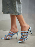 Baby-blue rear three-quarter view of pointed-toe buckle mule sandals with woven fabric upper, open toe, and high stiletto heel