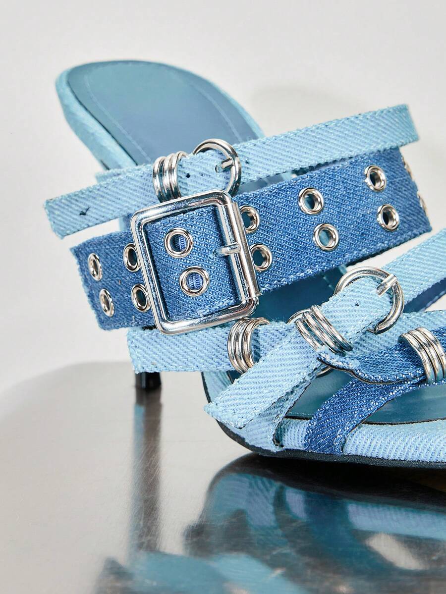 Baby-blue woven vamp close-up of pointed-toe buckle mule sandals with woven fabric upper, open toe, and high stiletto heel