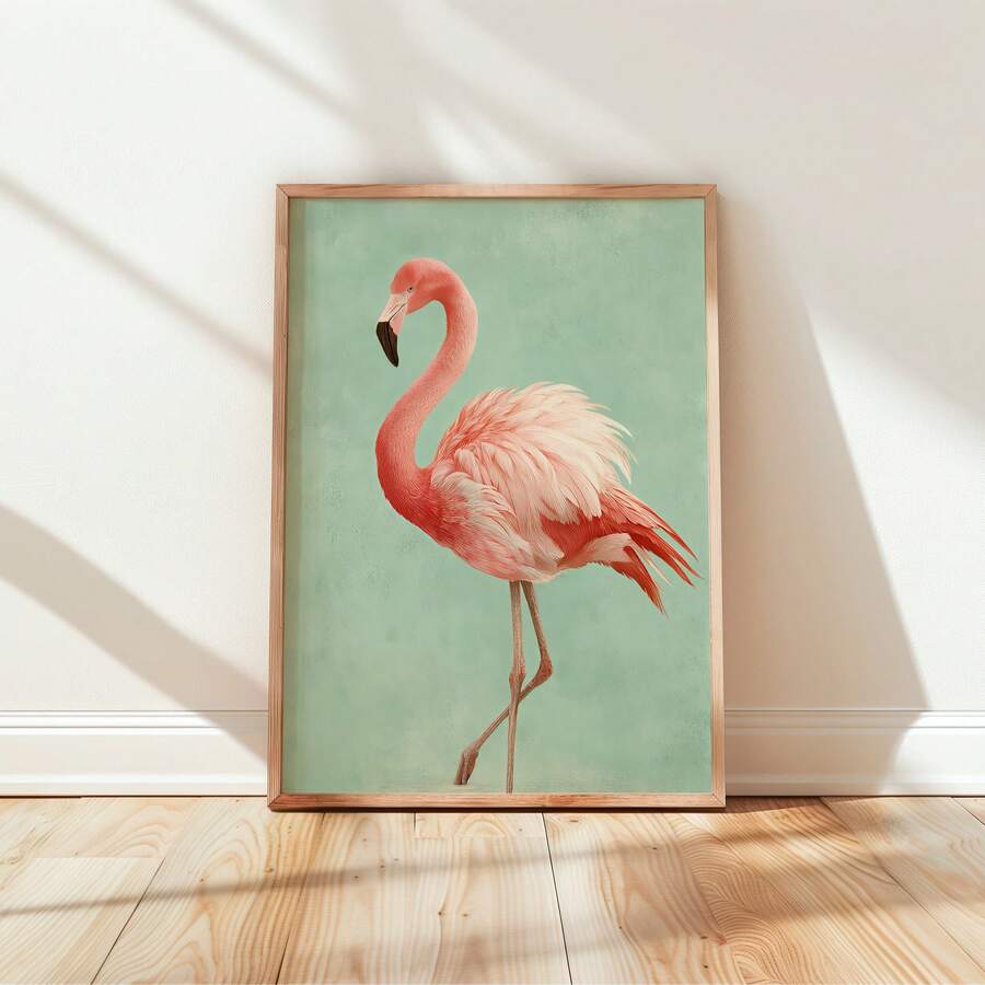 Framed pink flamingo print leaning on wood floor with window shadows