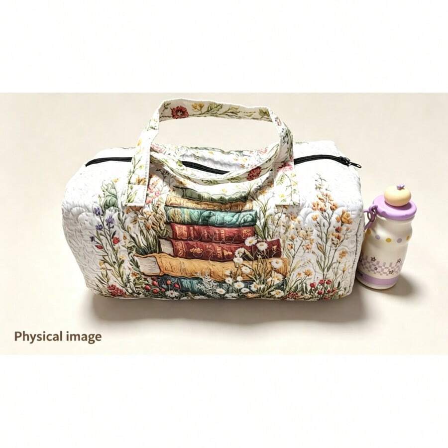 Quilted duffel bag with printed floral and stacked book design on table