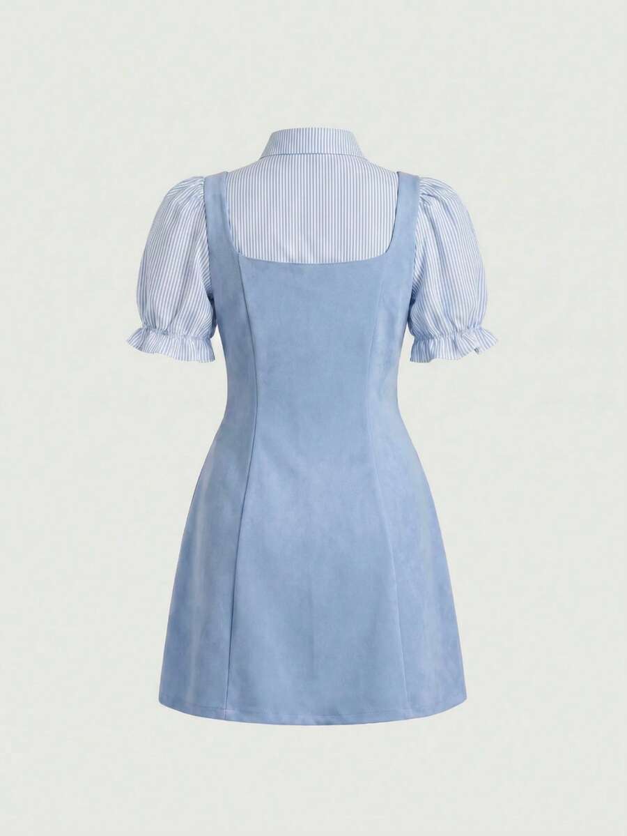 Plus size model in dusty-blue office mini dress with striped puff sleeves