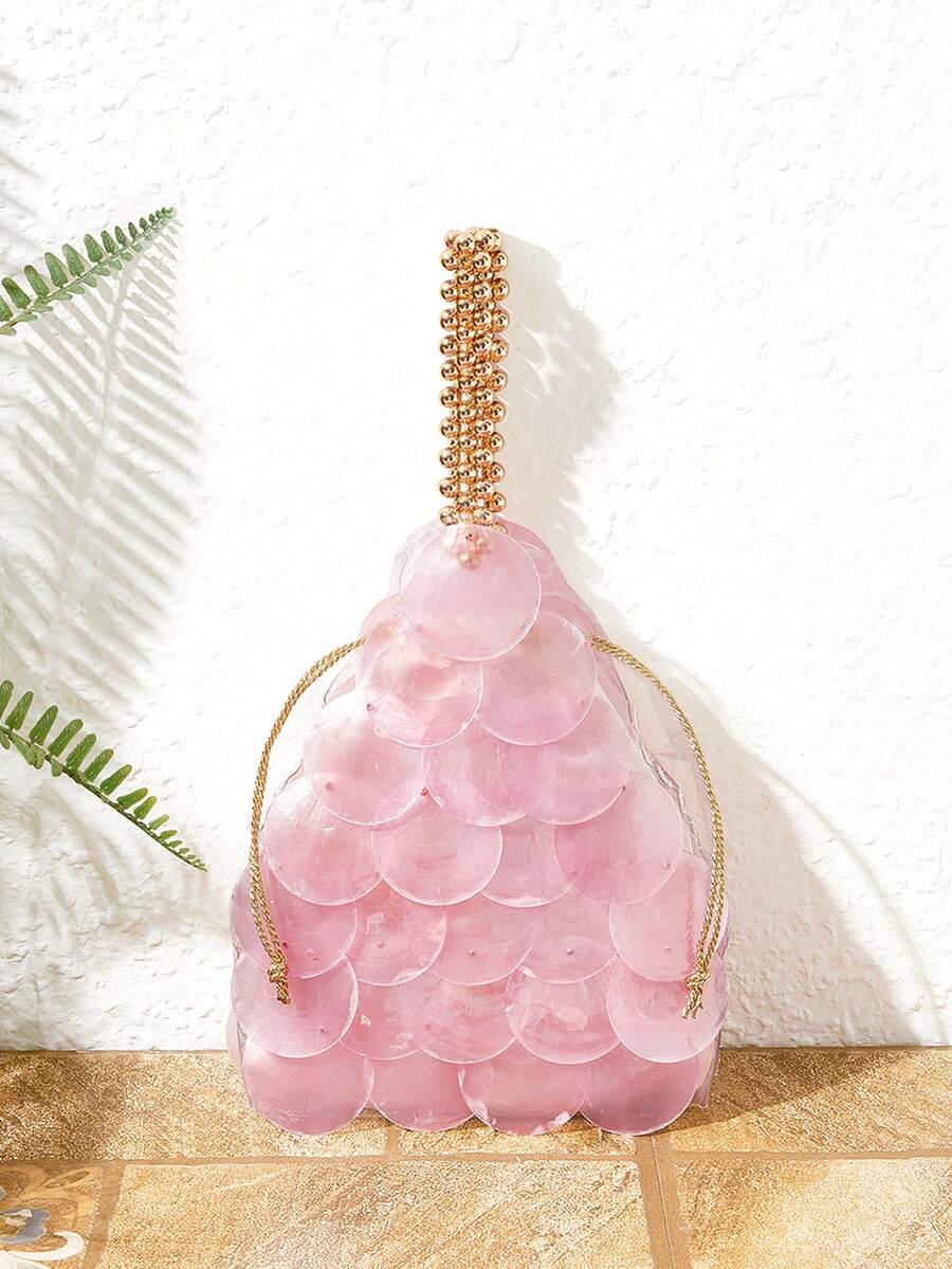 Pink shell disc mini bag with gold bead handle and drawstring closure