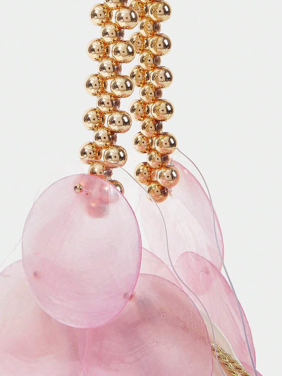 Close view of pink shell paillettes and satin drawstring top