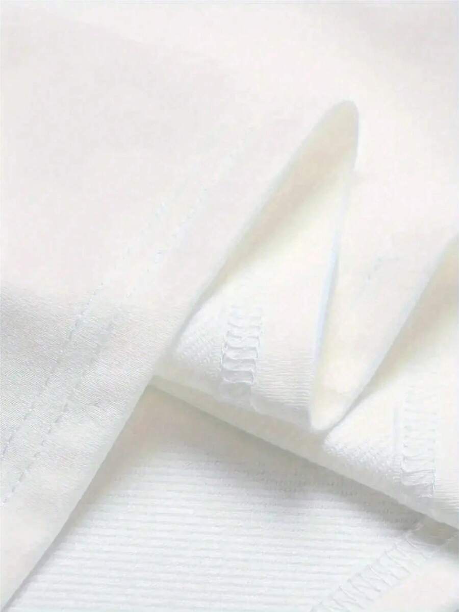 Close view of white cotton lemon graphic T-shirt with crewneck and smooth fabric
