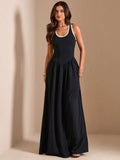 Black sleeveless maxi dress with white trim and full skirt