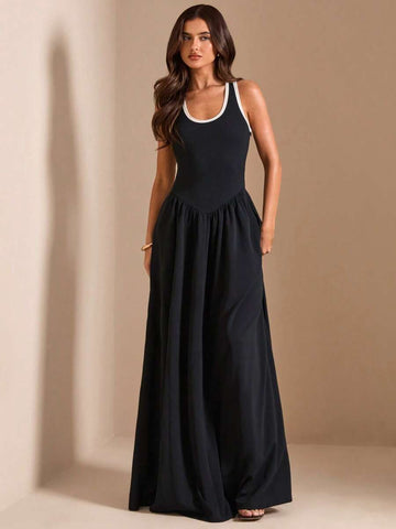 Black sleeveless maxi dress with white trim and full skirt