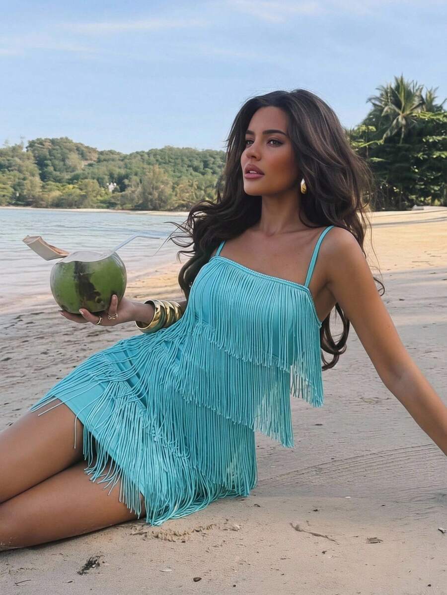 Turquoise fringe mini dress worn on beach