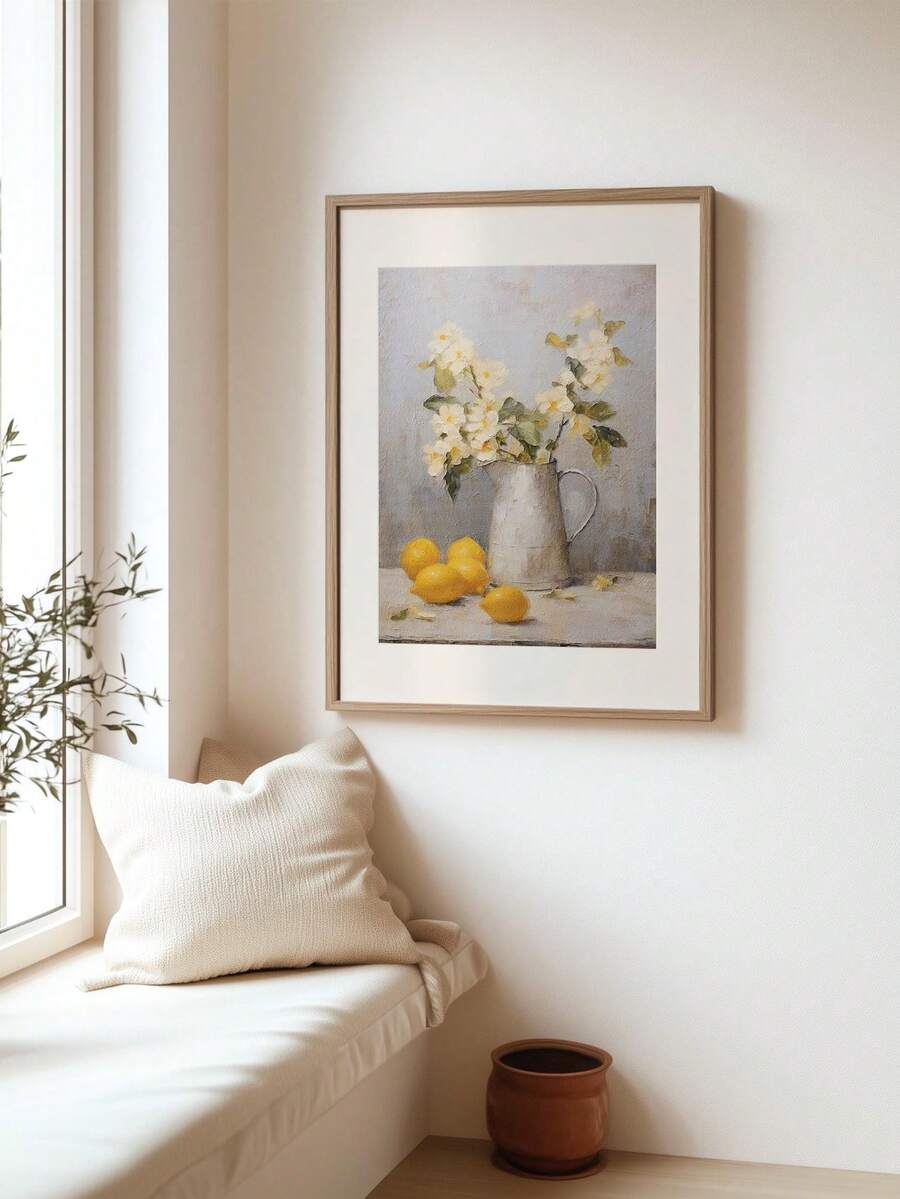 Framed vintage lemon and white floral still life canvas wall art above cozy window bench