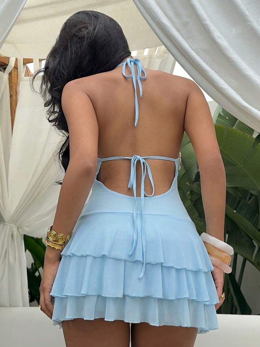 Front view of shell trim halter ruffle mini dress showing visible color, trim, and silhouette