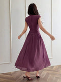 Back view of dark plum A-line maxi dress with fitted high waist