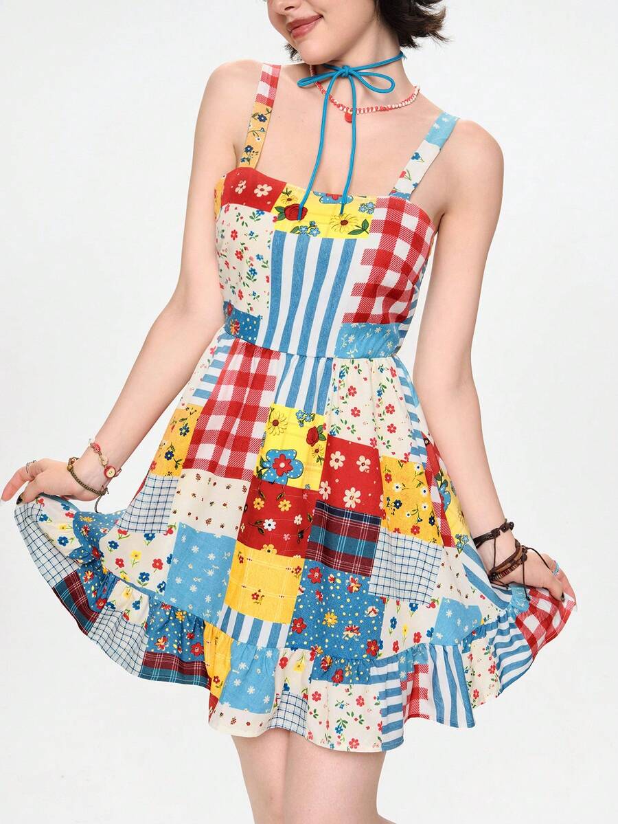 Full front model view of multicolor patchwork babydoll mini dress with wide straps and ruffle hem