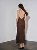 Close detail view of brown beaded spaghetti strap knit maxi dress showing visible color, trim, and silhouette