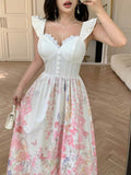 Close detail view of white floral corset bodice ruffle strap maxi dress showing visible color, trim, and silhouette