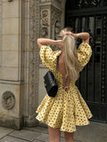 Yellow lace-up back polka dot dress rear view