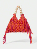 Orange and pink crochet beach bag on white background with hollow knit fringe sides and bead handle