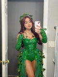 Front mirror view of green sequin Poison Ivy costume with leafy bodice, sheer overskirt and opera gloves
