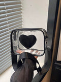 Transparent heart shoulder bag with silver hardware black trim and rounded rectangular box shape