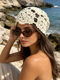 Cream floral crochet beanie cap with open holes and scalloped edge