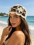 Cream floral crochet beanie cap with open holes and scalloped edge
