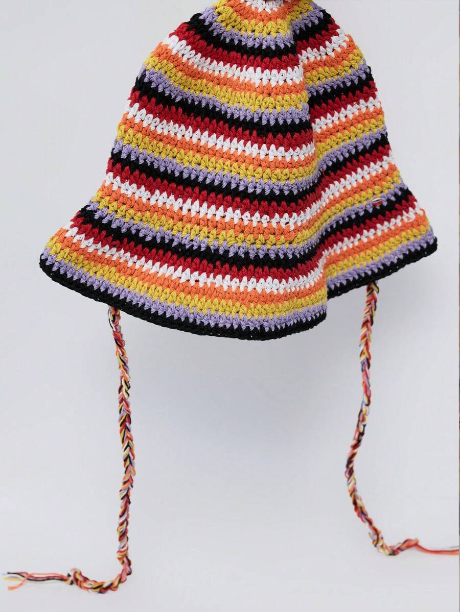 Front view of multicolor striped crochet bucket hat with floppy brim and braided side ties