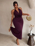 Front view of plum plus size halter maxi dress with gold collar and draped neckline