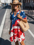 Three quarter close view of patriotic puff sleeve tiered dress with stars stripes and V neck
