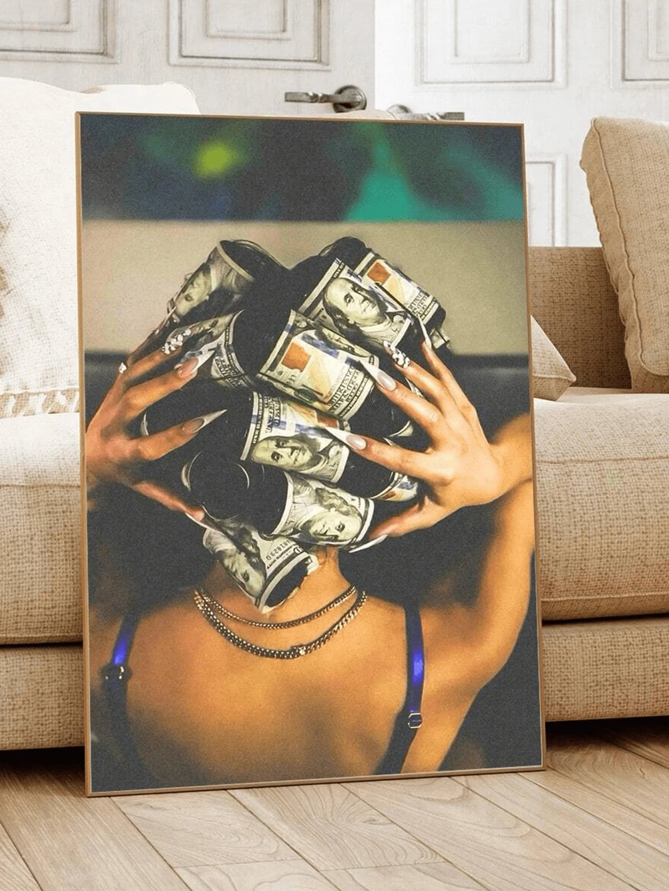 Warm color woman holding rolled dollar bills in tan wood frame