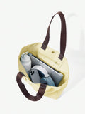 Canvas sport tote bag capacity view with laptop bottle phone and daily essentials