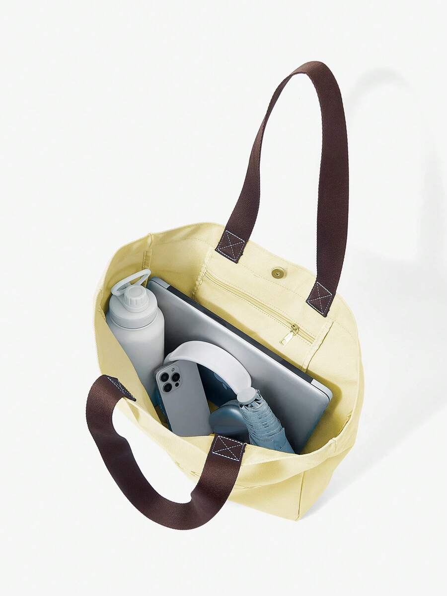 Canvas sport tote bag capacity view with laptop bottle phone and daily essentials