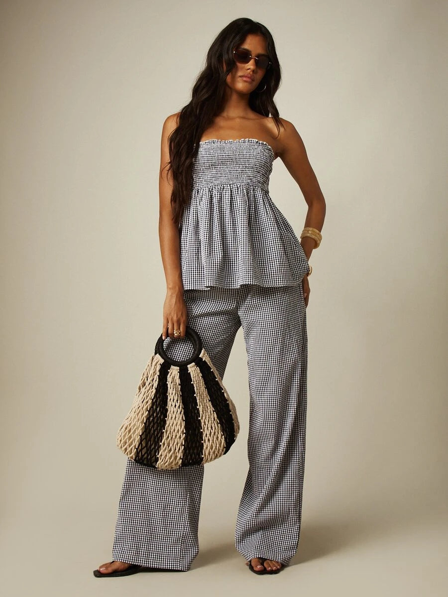Front view of black white gingham two piece set with strapless smocked bandeau top and wide leg pants
