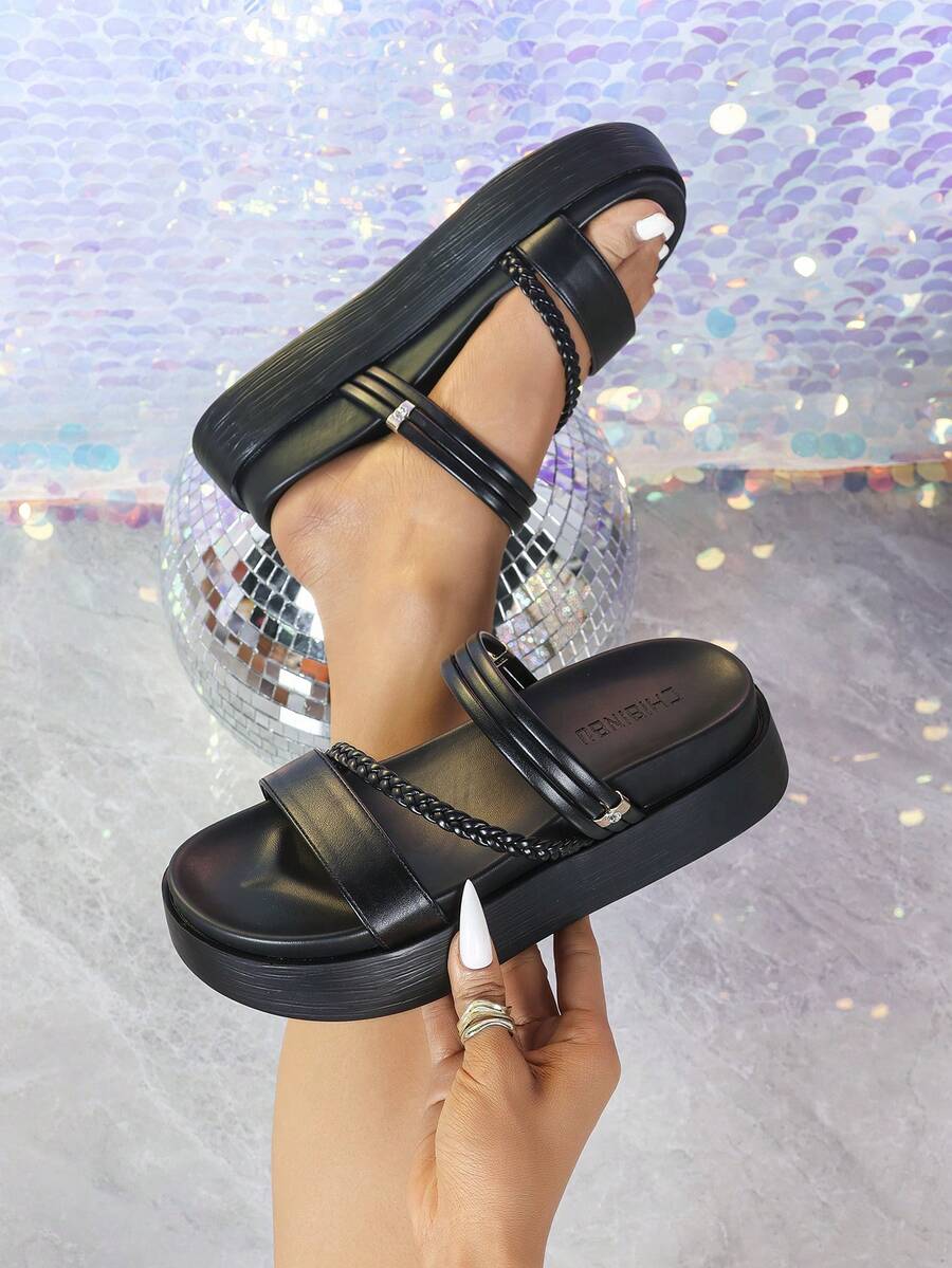 Multi strap platform sandals detail view showing adjustable buckle and padded rounded footbed