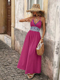 Front view of hot pink boho halter maxi dress with geometric high waist and flared skirt