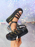 Black slingback platform sandals lifestyle view with silver buckle and open toe